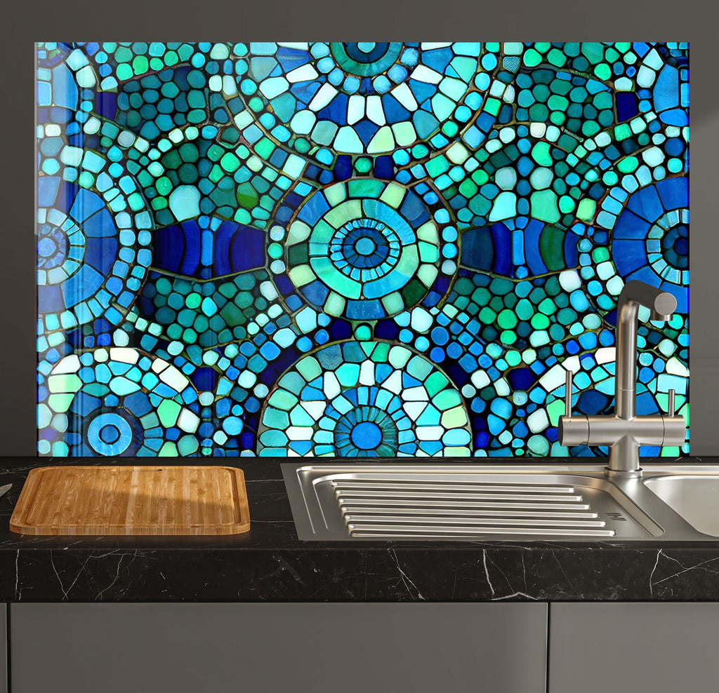 a kitchen counter with a sink and a mosaic tile backsplash