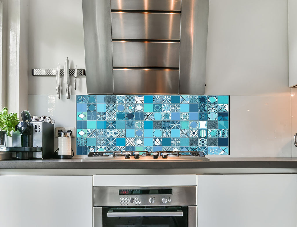 a stove top oven sitting inside of a kitchen