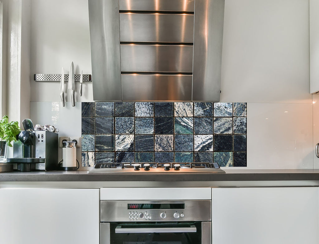 a stove top oven sitting inside of a kitchen