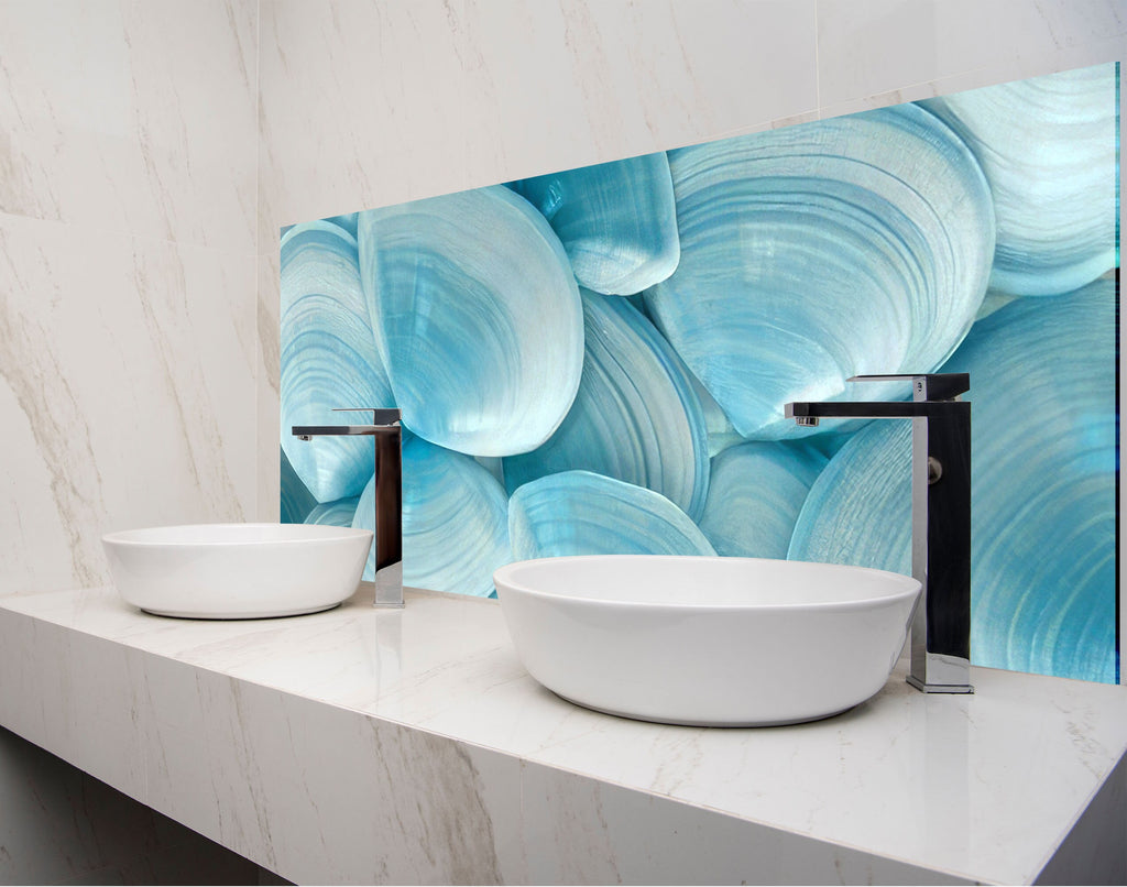 two white bowls on a counter in a bathroom