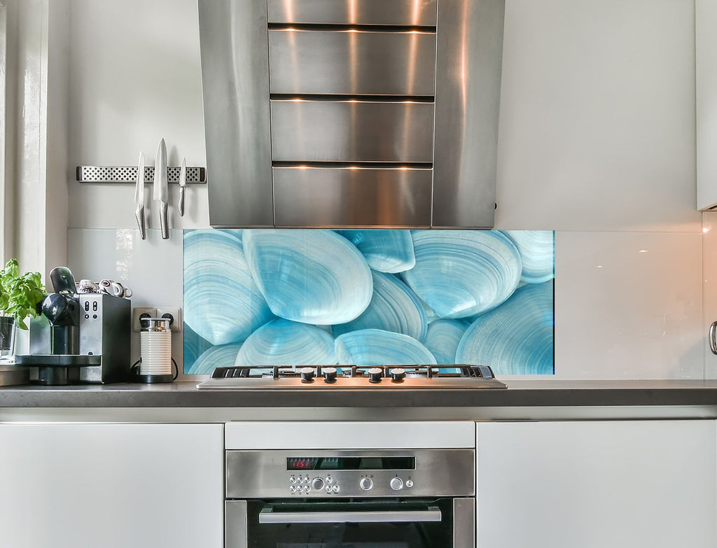 a stove top oven sitting inside of a kitchen