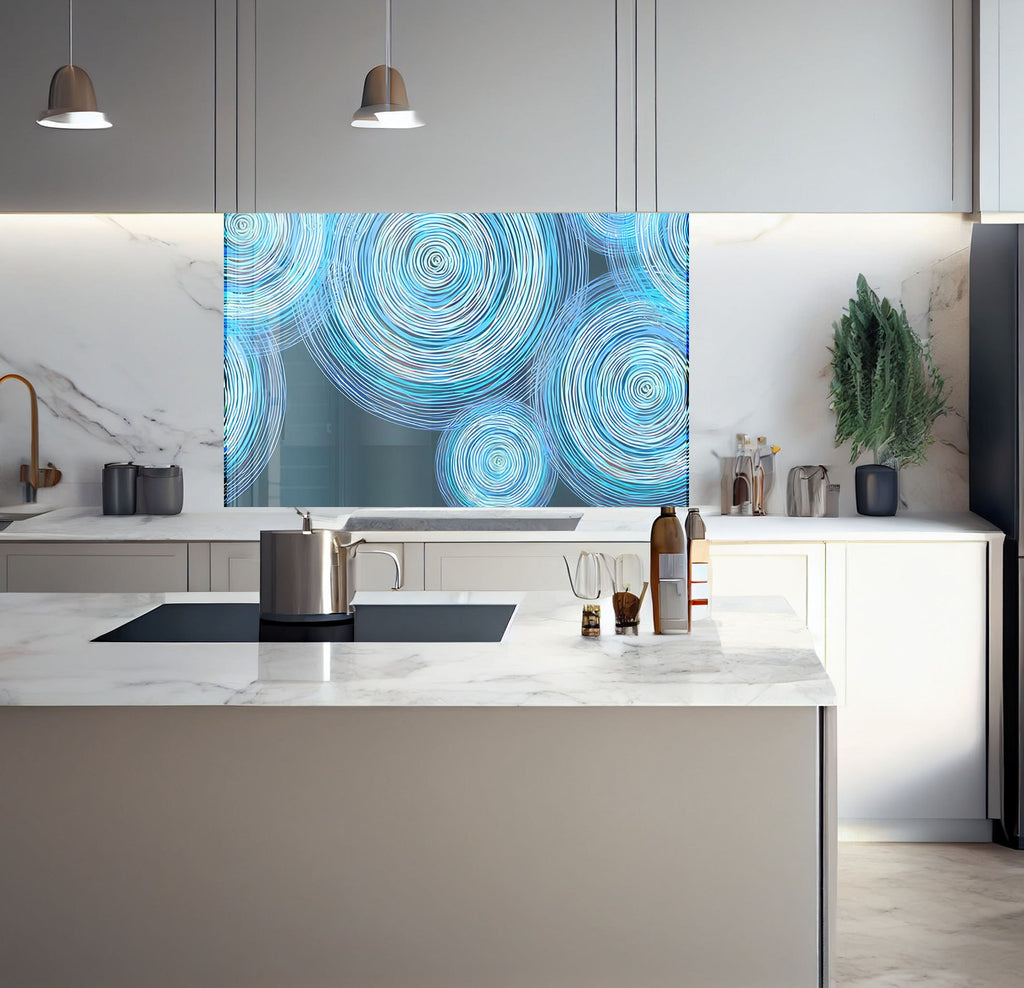 a kitchen with a marble counter top and a painting on the wall