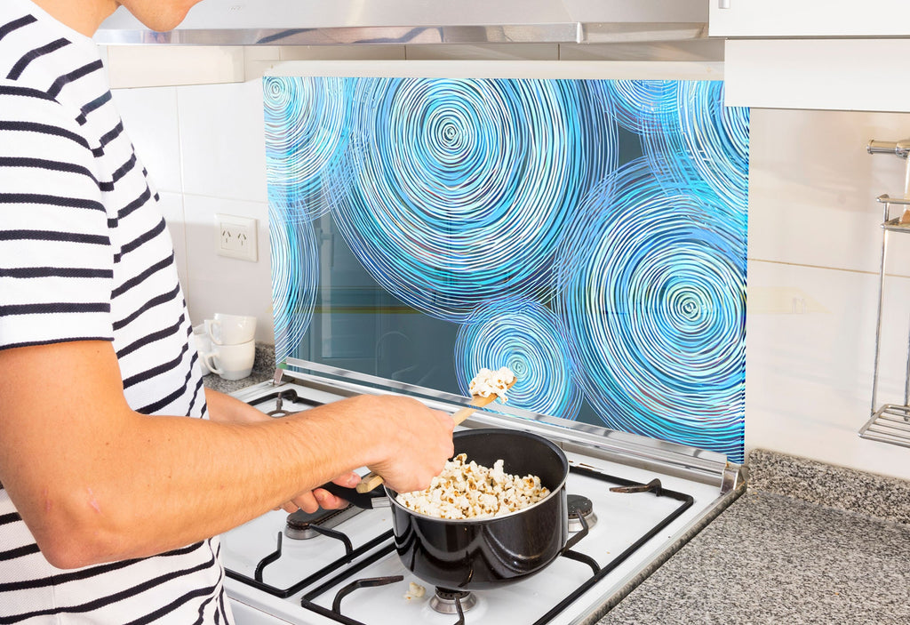 a man is cooking popcorn on the stove