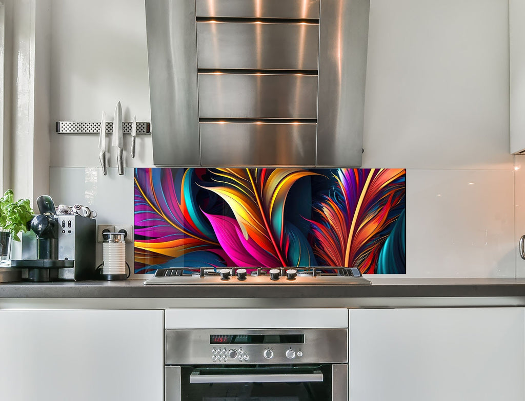 a kitchen with stainless steel appliances and a colorful painting on the wall