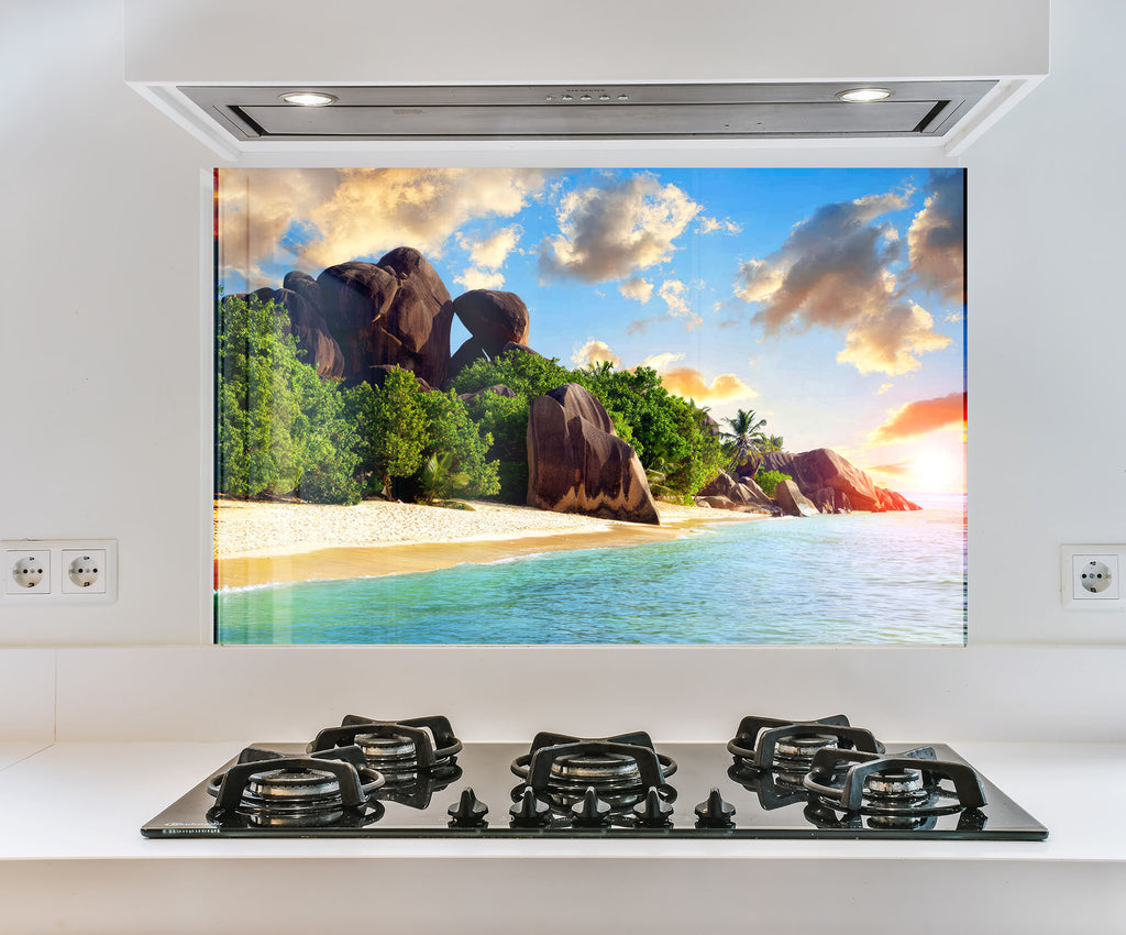 a picture of a beach is on the wall above the stove