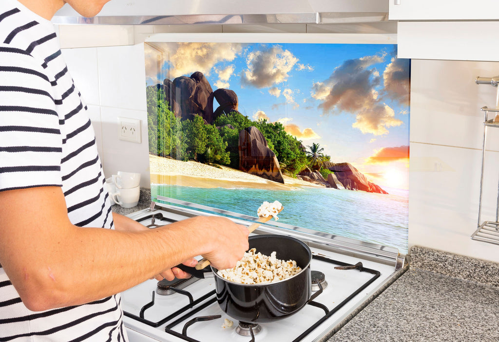 a man is cooking popcorn on the stove