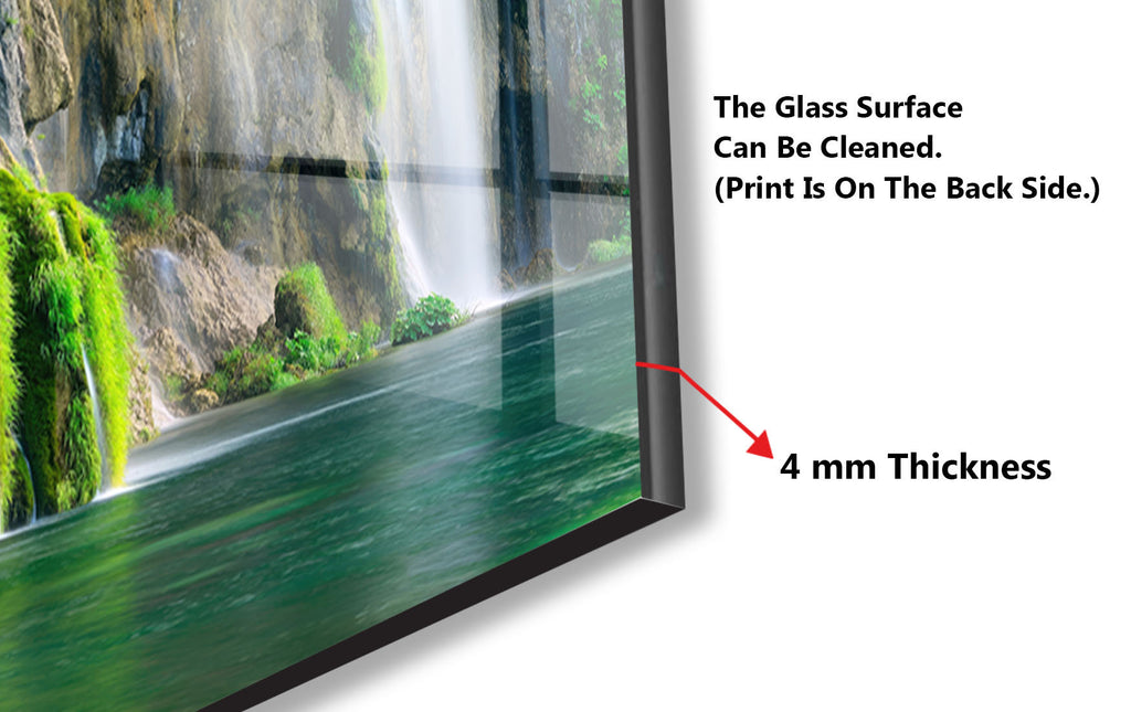 a picture of a waterfall with a glass frame