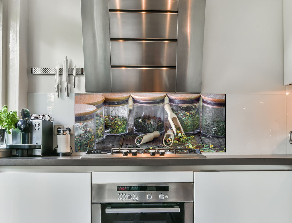 a kitchen with a stainless steel stove top oven