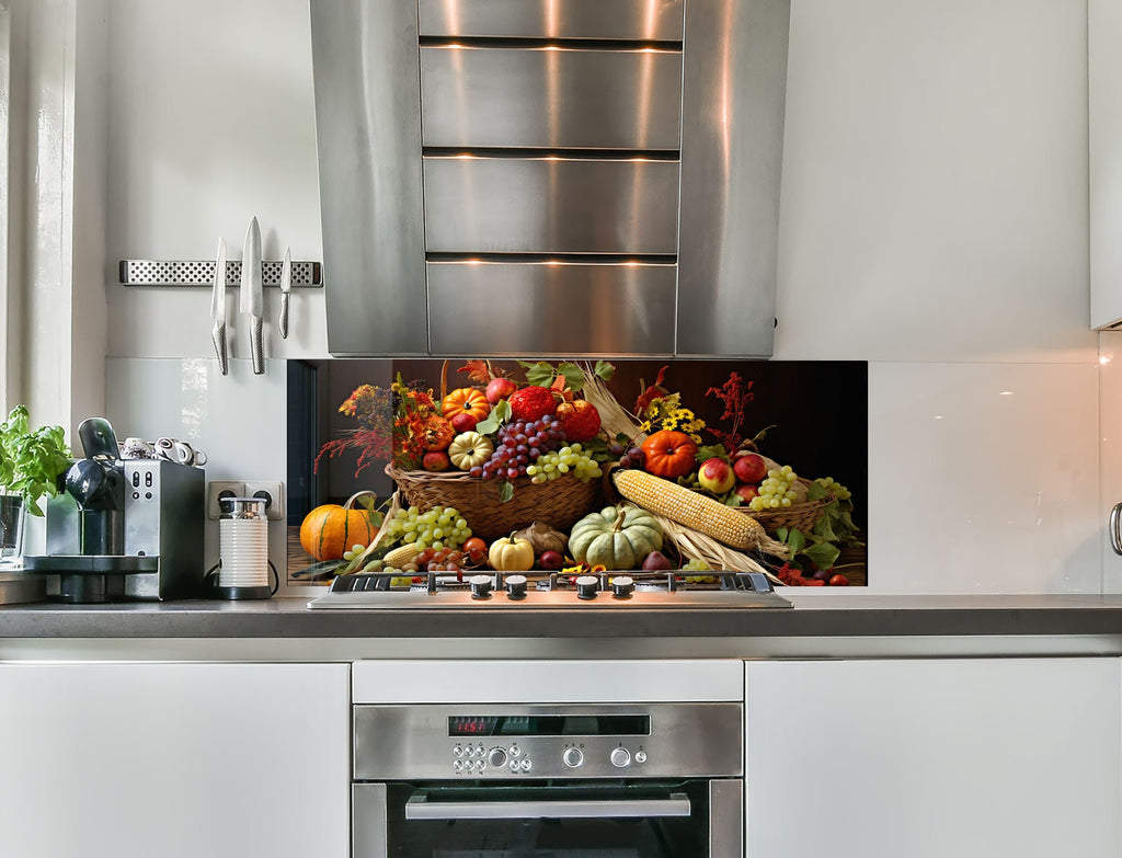 a kitchen with stainless steel appliances and a large display of fruit