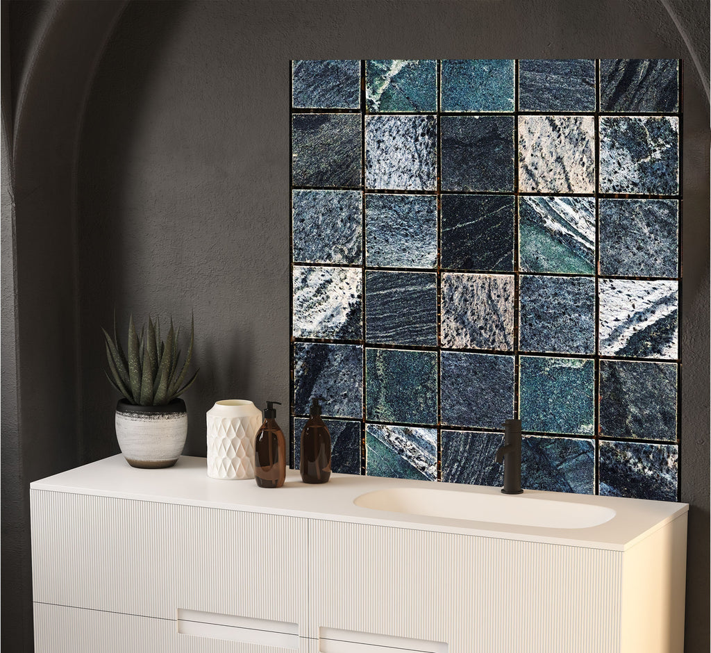 a bathroom with a sink and a tiled wall