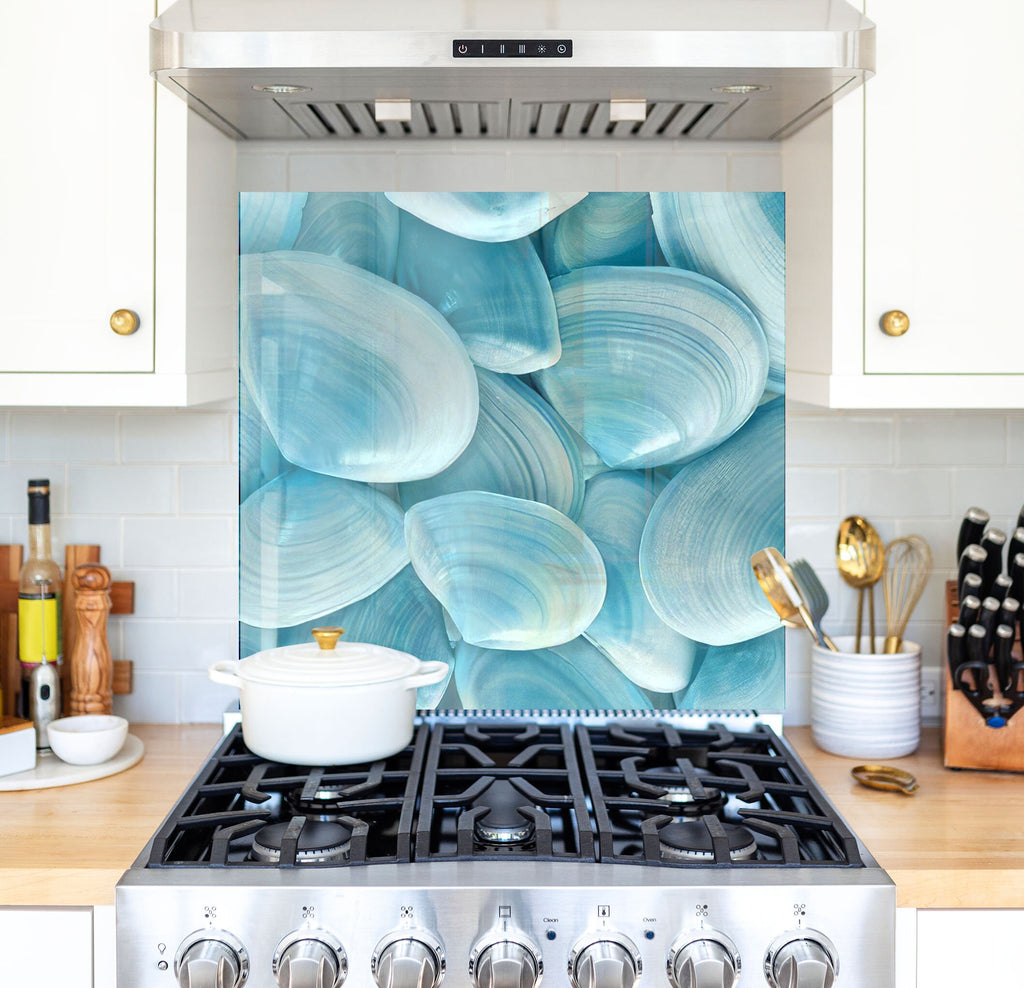 a stove top oven sitting inside of a kitchen