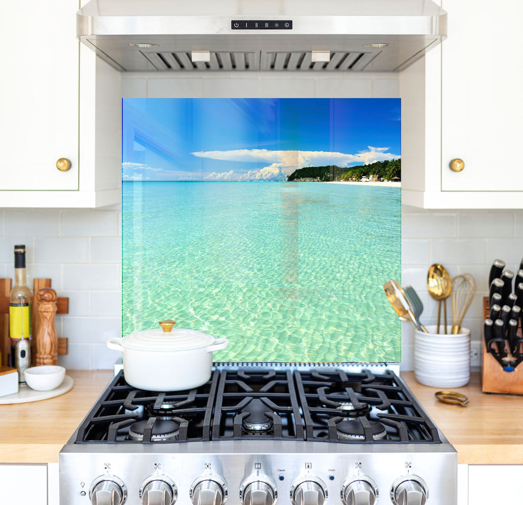 a stove top oven sitting inside of a kitchen