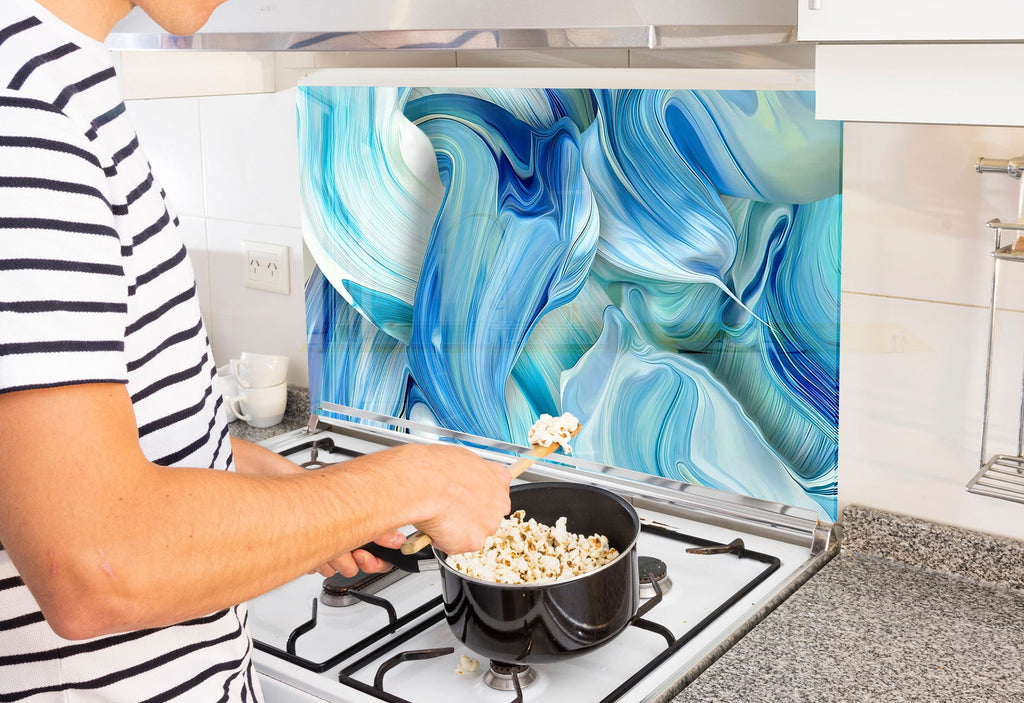 a man is cooking popcorn on the stove