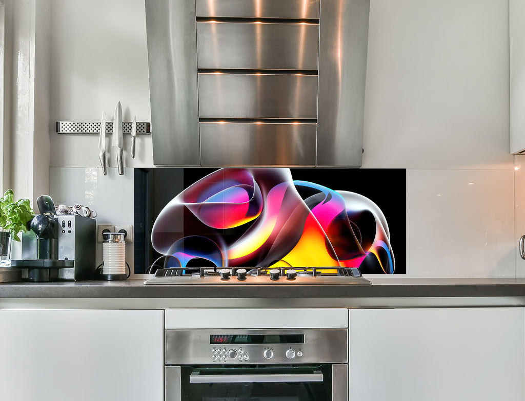 a kitchen with stainless steel appliances and a television