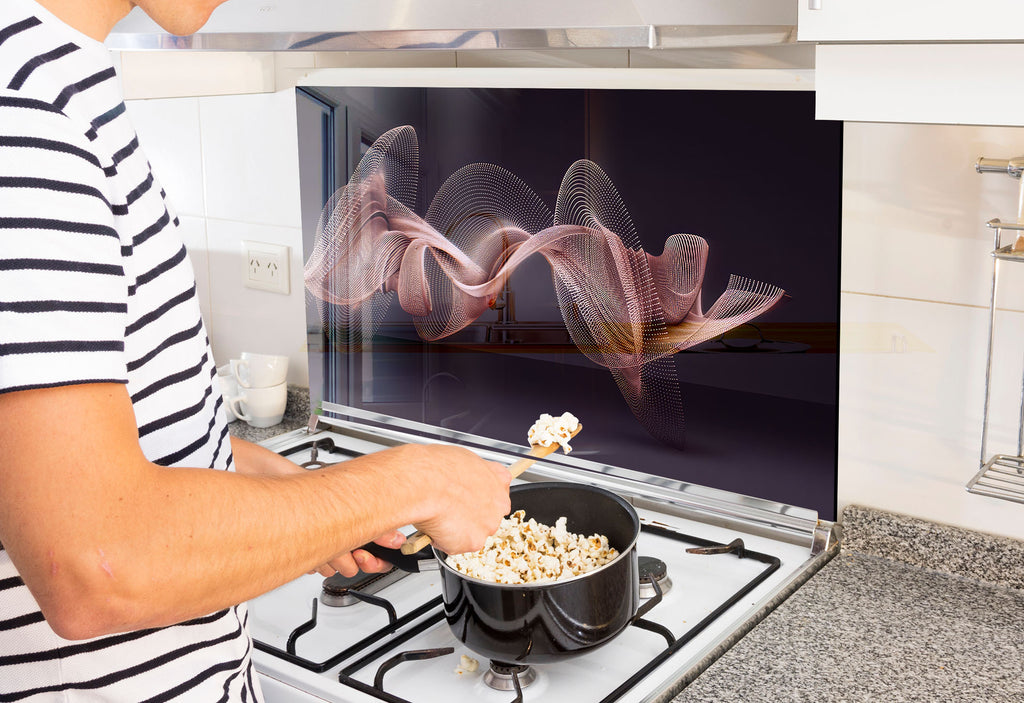 a man is cooking popcorn on the stove