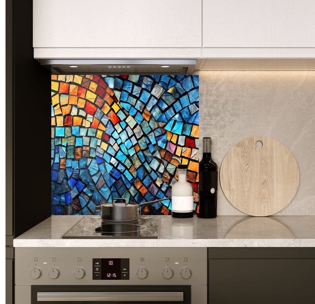 a stove top oven sitting under a colorful tile backsplash