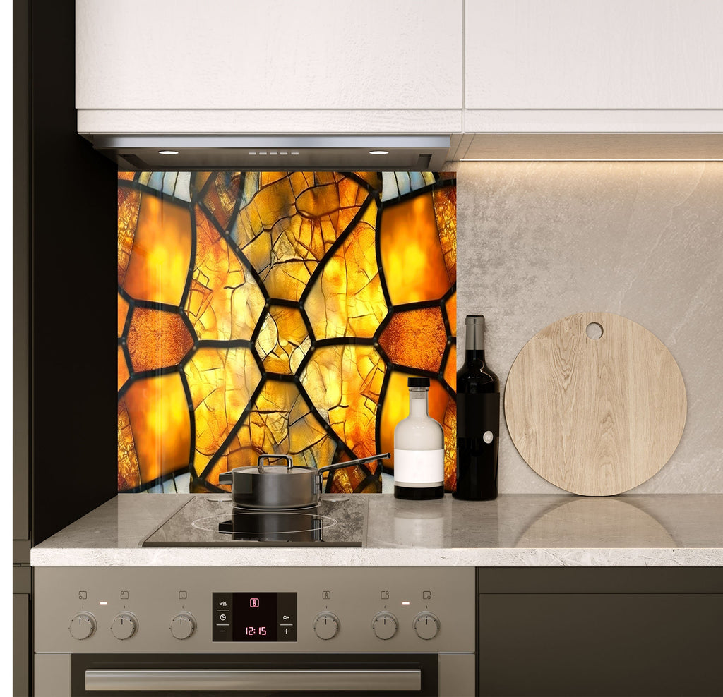 a stove top oven sitting under a stained glass window