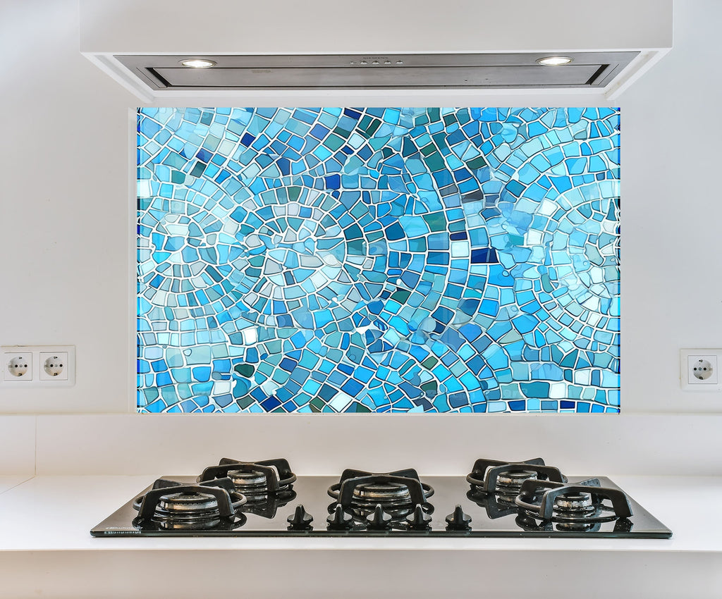 a blue mosaic tile backsplash mounted on a wall above a stove