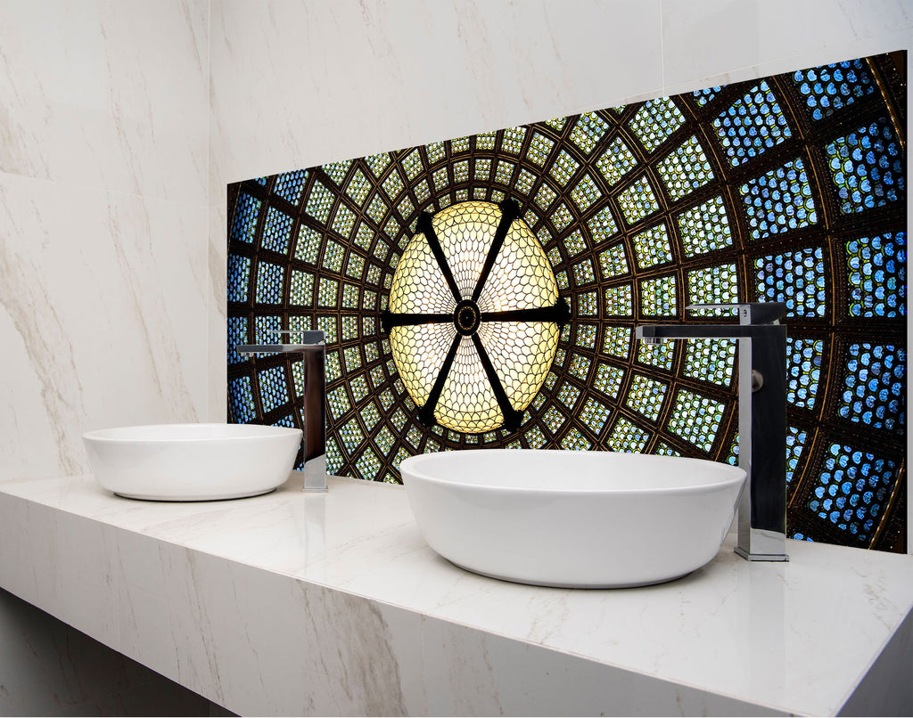 a bathroom with two sinks and a stained glass window