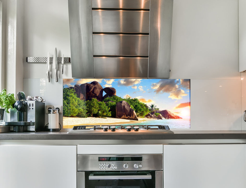 a kitchen with an oven, microwave and a television