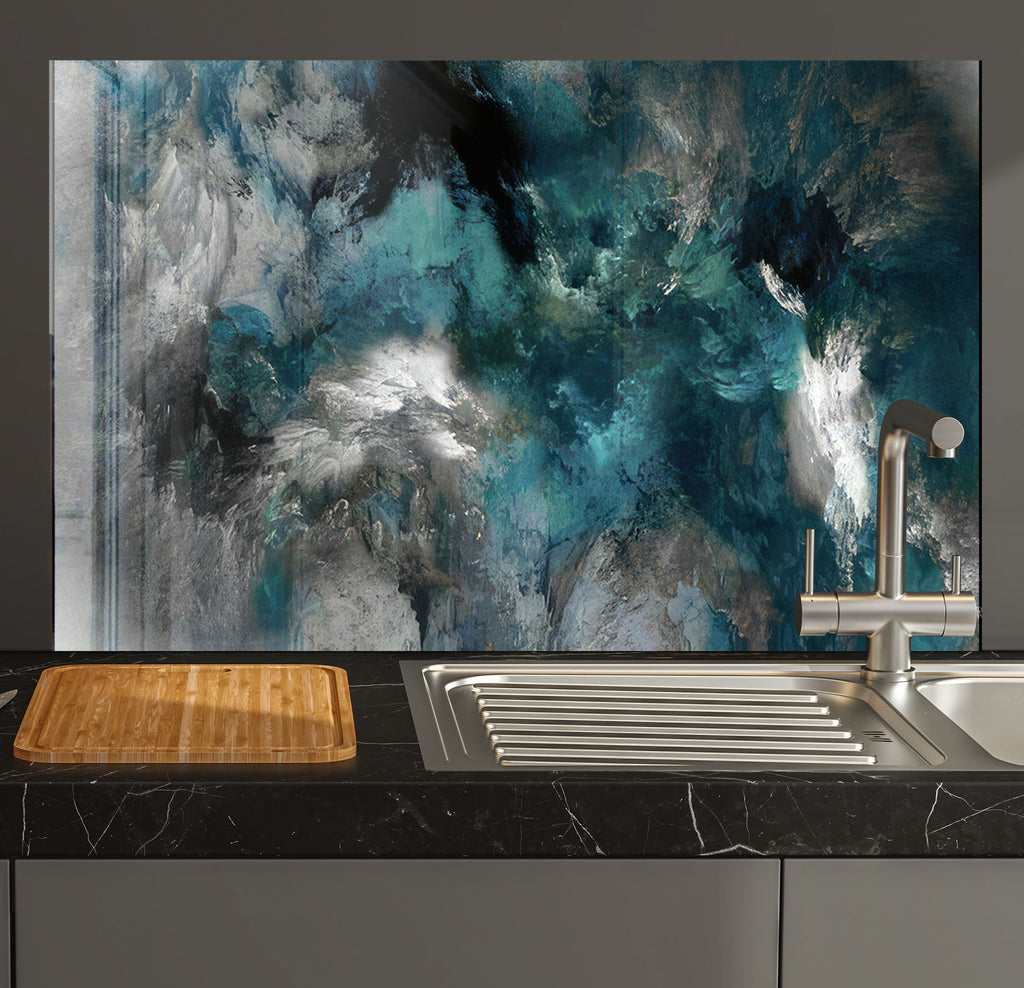 a kitchen counter with a sink and a painting on the wall