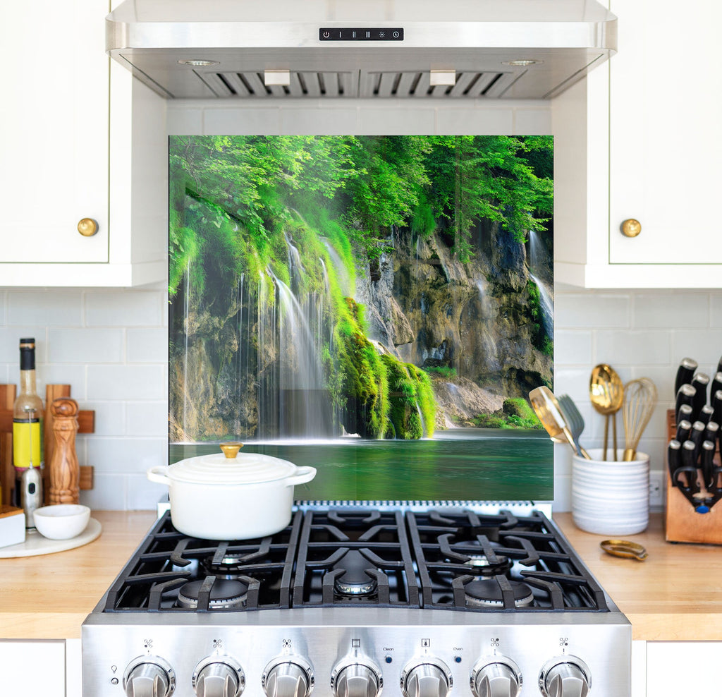 a stove top oven sitting inside of a kitchen