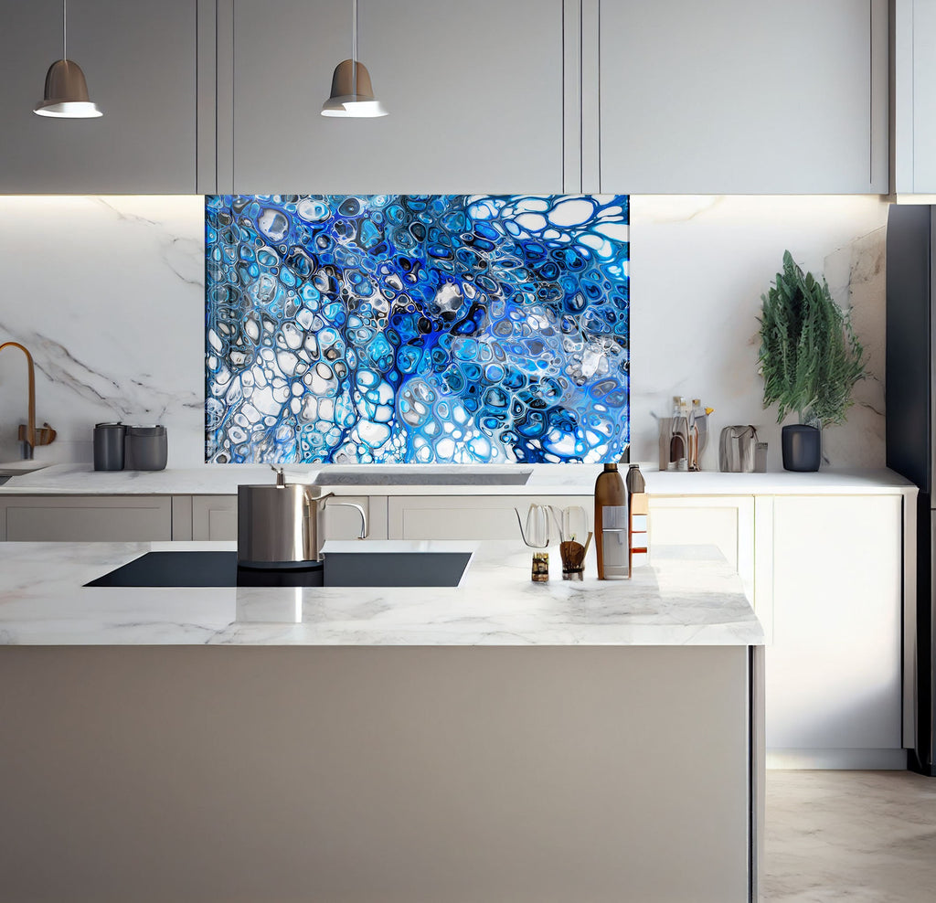 a kitchen with a marble counter top and a painting on the wall