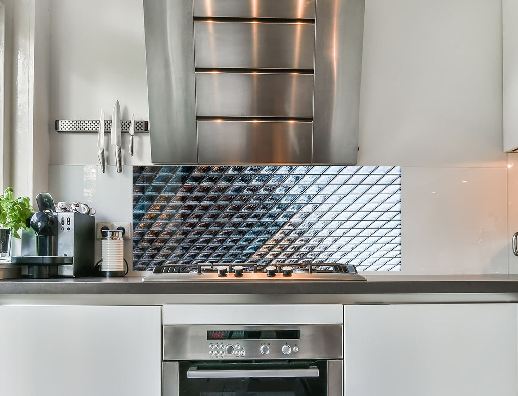 a kitchen with a stainless steel stove and oven