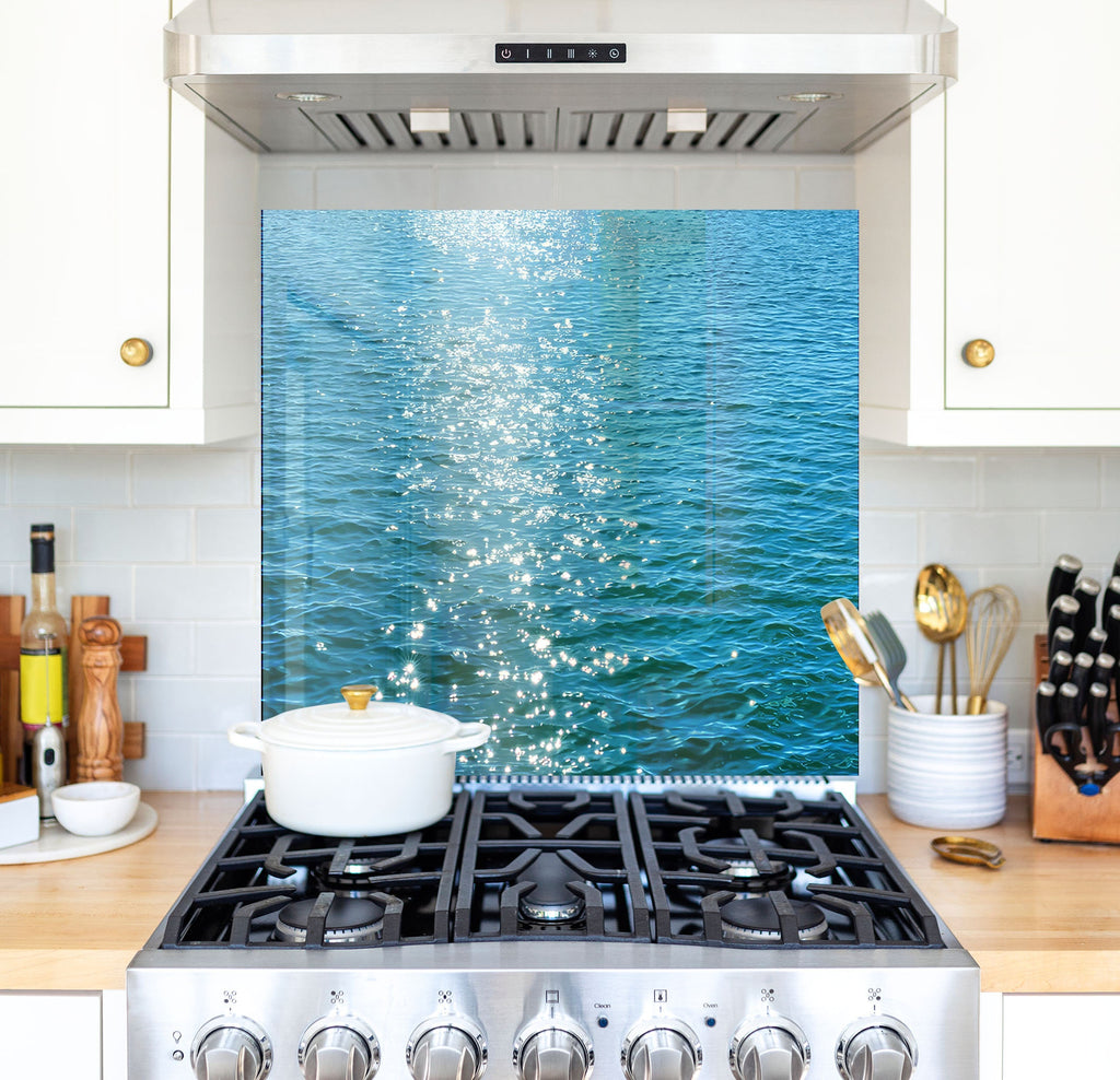 a stove top oven sitting inside of a kitchen