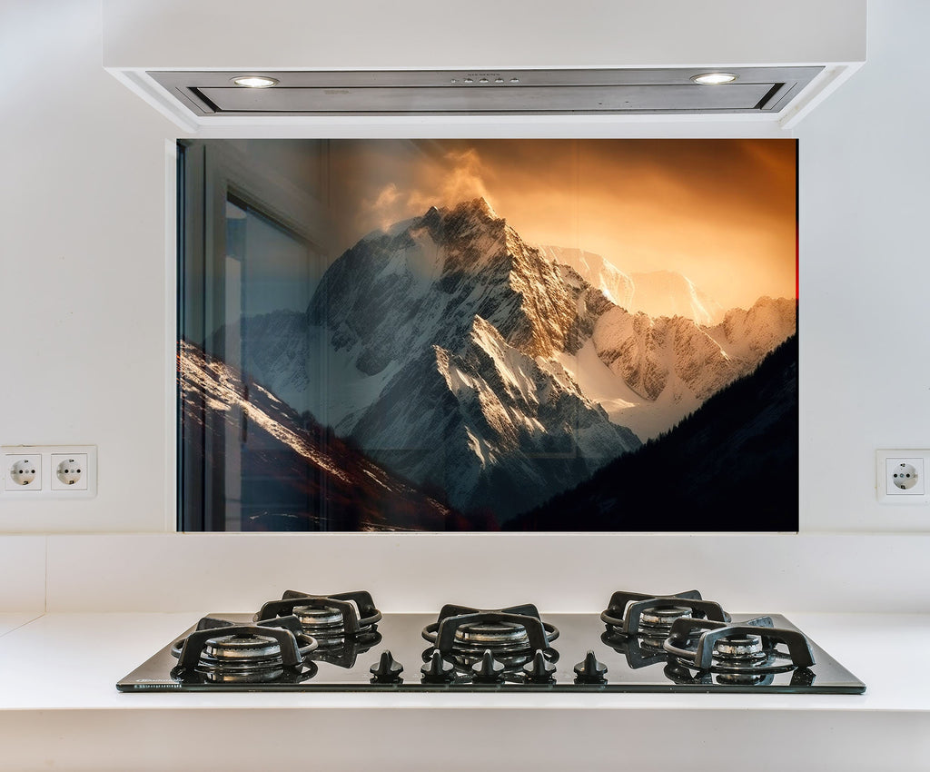 a picture of a mountain in the window of a kitchen