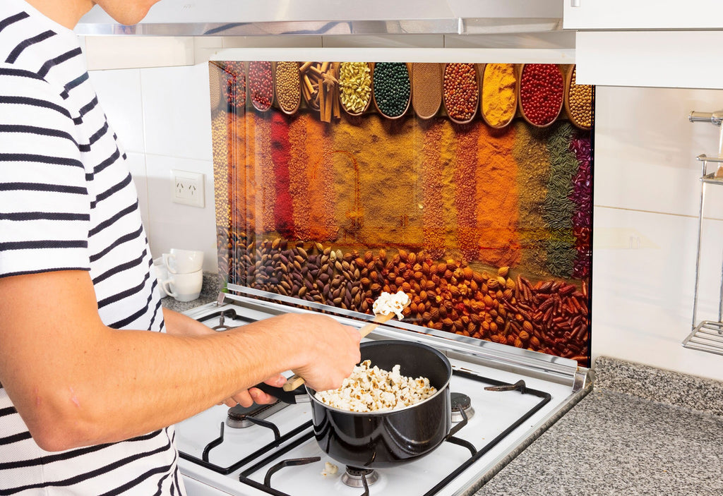 a man cooking food on a stove in a kitchen