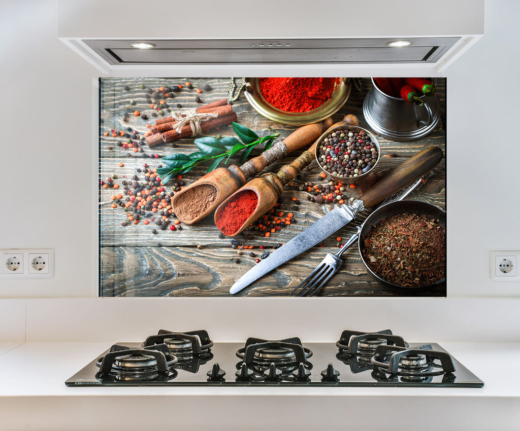 a picture of spices on a wall above a stove