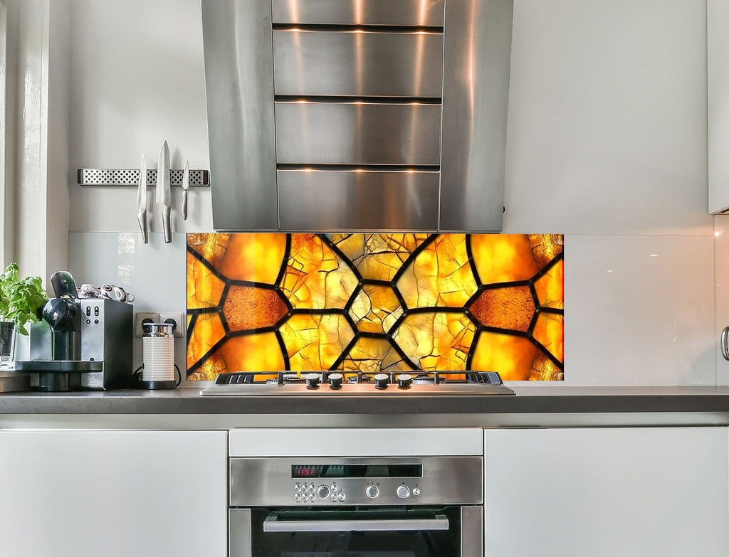 a stove top oven sitting under a stained glass window