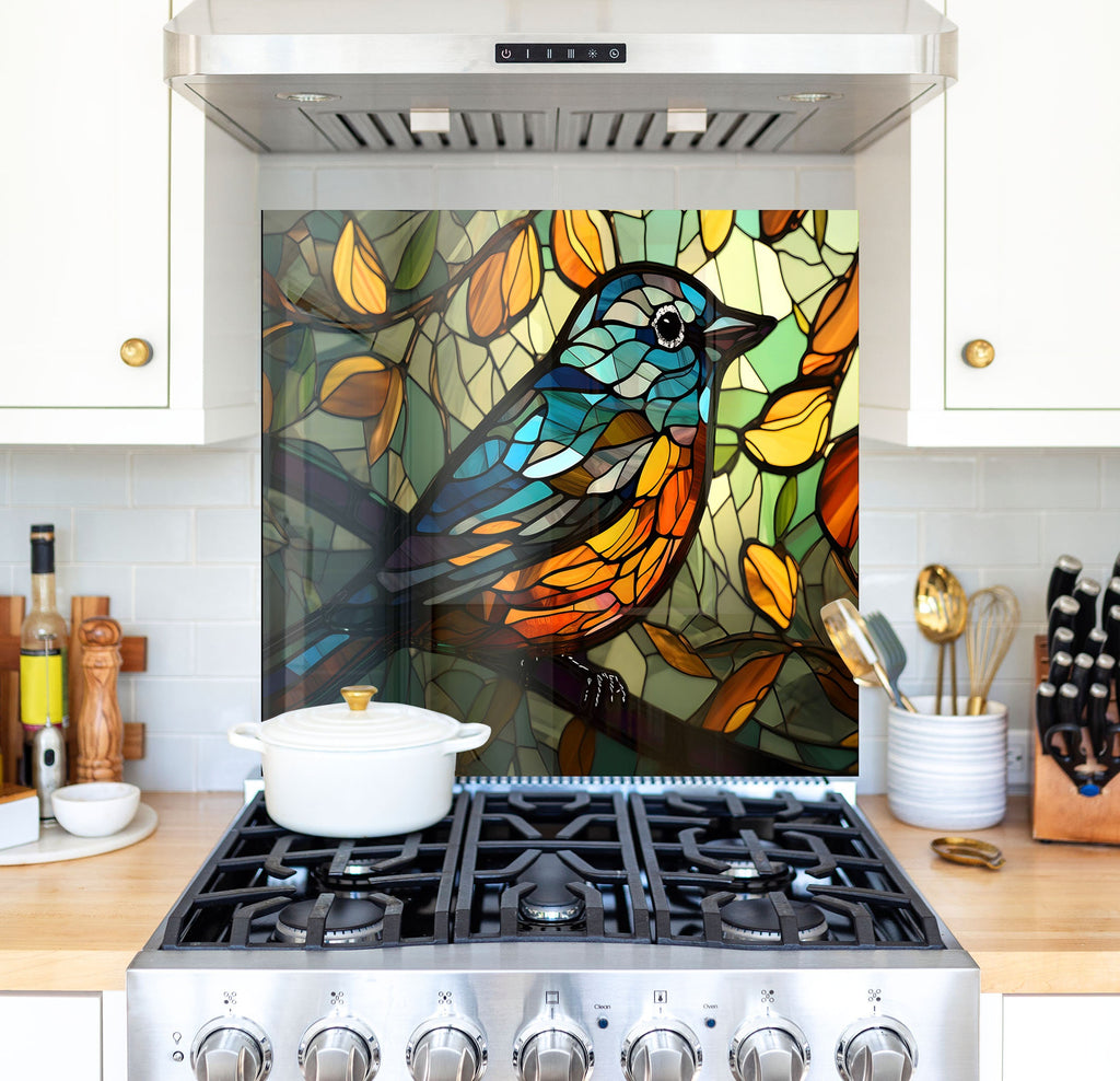 a kitchen with a stove top oven and a stained glass mural