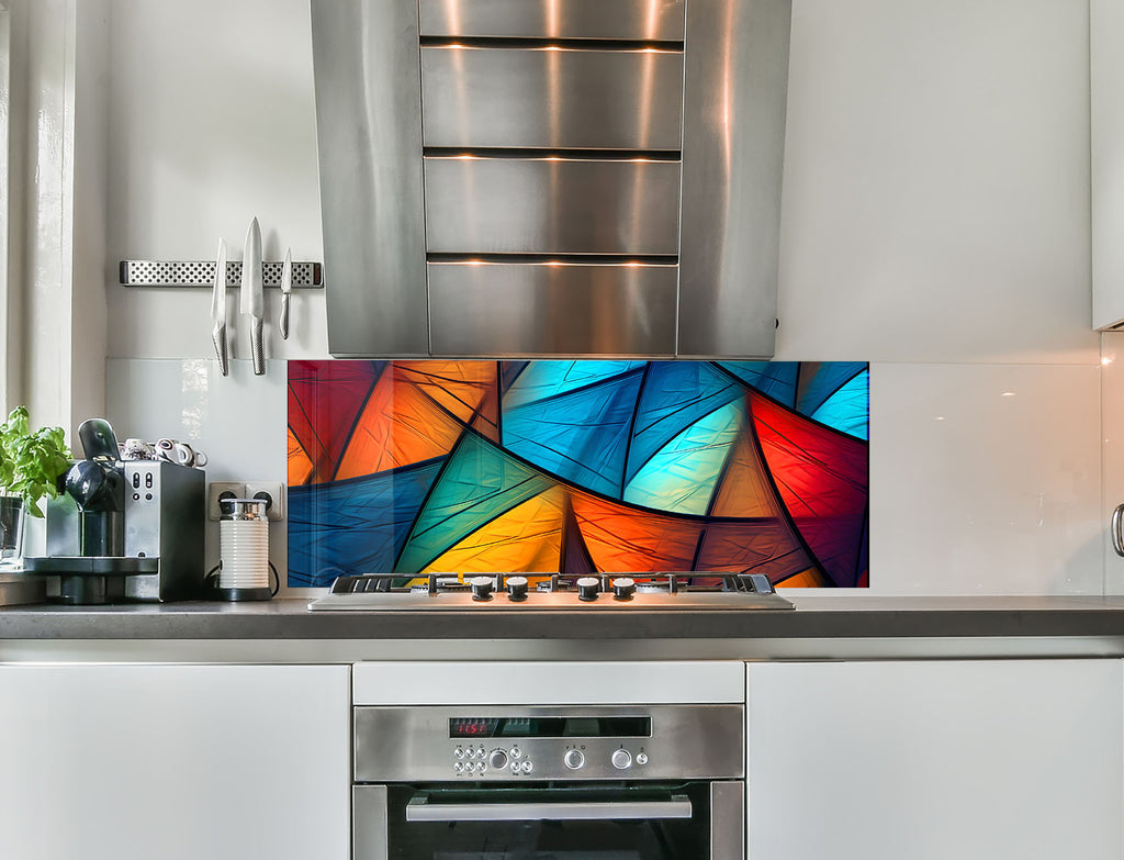 a kitchen with stainless steel appliances and a colorful painting on the wall