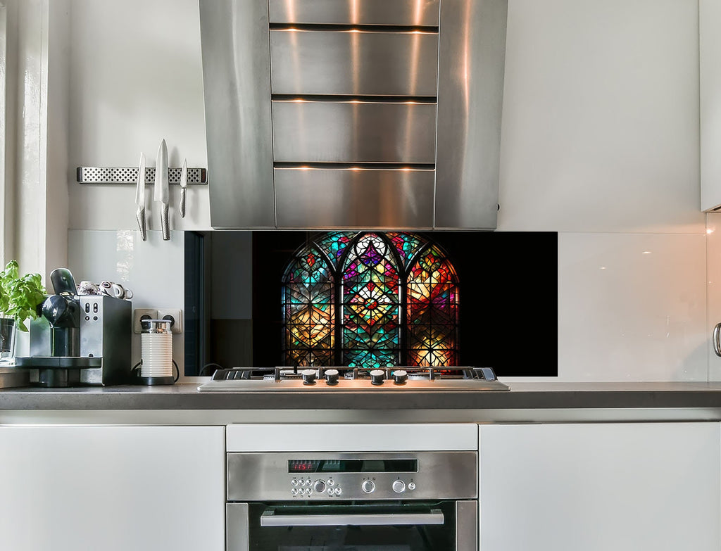 a kitchen with a stainless steel stove and a stained glass window